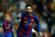 Barcelona's Argentinian forward Lionel Messi celebrates after scoring during the Spanish league Clasico football match Real Madrid CF vs FC Barcelona at the Santiago Bernabeu stadium in Madrid on April 23, 2017. / AFP PHOTO / OSCAR DEL POZO (Photo credit should read OSCAR DEL POZO/AFP/Getty Images)
